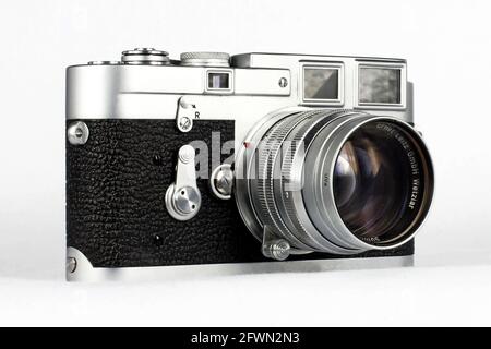 A vintage Leica M3 rangefinder camera with a Summarit 50mm f1.5 Ernst Leitz lens. Stock Photo