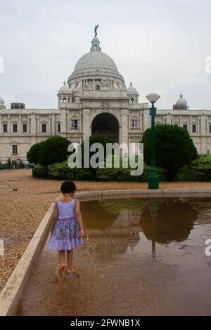 Kolkata, India. Child walks in front of the Victoria Memorial Stock Photo