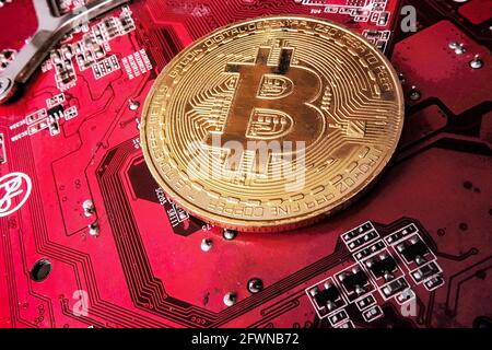 the bitcoin coin is on the graphics card board. Stock Photo