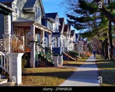 Chicago, Illinois, USA. Single-family homes line a neat city block in the Albany Park neighborhood of Chicago on a quiet weekend afternoon. Stock Photo