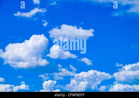 Big white clouds are floating in the blue sky Stock Photo