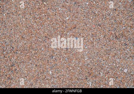 sea sand texture from beach useful as background. Stock Photo