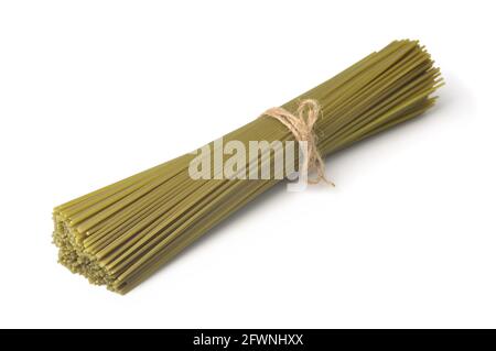 Bunch of green uncooked spinach spaghetti isolated on white Stock Photo