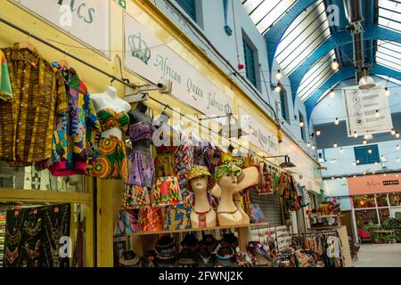 Brixton, London- May 2021: Inside Brixton Village which is part of Brixton Market- an indoor hall of world food stalls, bars and shops. Stock Photo