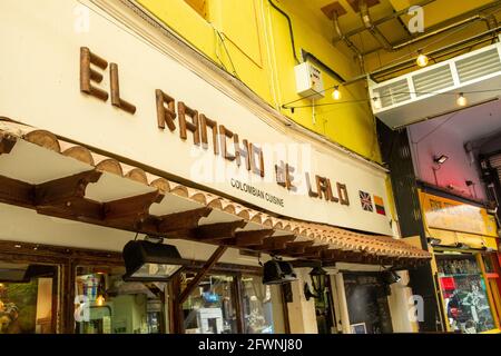 Brixton, London- May 2021: Inside Brixton Village which is part of Brixton Market- an indoor hall of world food stalls, bars and shops. Stock Photo