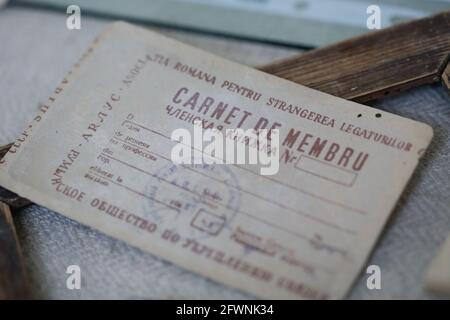 Marghia, Romania - May 5, 2021: Shallow depth of field (selective focus) details with old Communist card in the rural area (co-operative system). Stock Photo