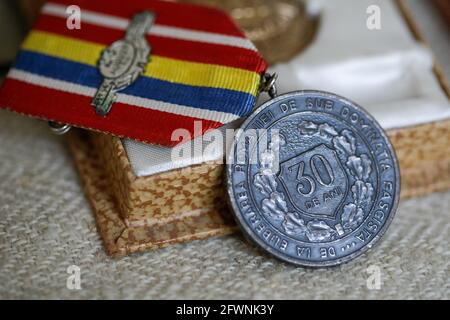 Marghia, Romania - May 5, 2021: Shallow depth of field (selective focus) details with old Communist award medal. Stock Photo