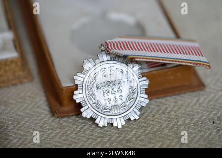 Marghia, Romania - May 5, 2021: Shallow depth of field (selective focus) details with old Communist award medal. Stock Photo