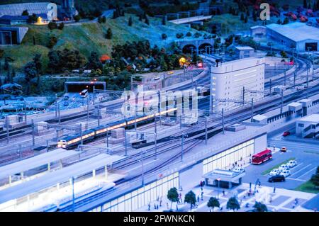 The model railway at the SCMaglev and Railway Park, Nagoya, Japan. Shows a day in the life of the railway and is night. Model of Nagoya station. Stock Photo