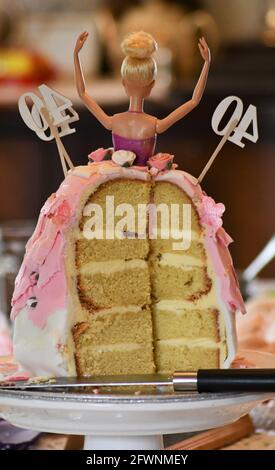 40th Barbie birthday cake sliced from the rear Stock Photo
