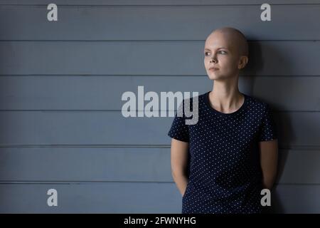 Tired serious cancer patient thinking of painful treatment Stock Photo