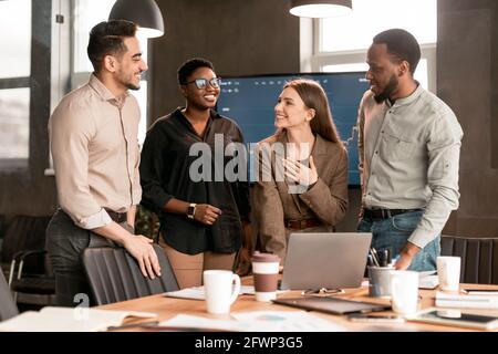 Colleagues having meeting in boardroom, working on a project Stock Photo