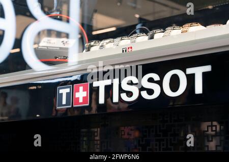 Tissot brand logo of a Swiss watch on the counter in a shopping