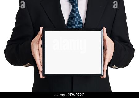 Businessman holds a blank signboard on isolated white background. Stock Photo