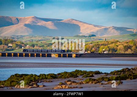 View of Arnside viaduct over the Kent Estuary towards the Yorkshire Dales fells from Arnside, Milnthorpe, Cumbria, UK. Stock Photo