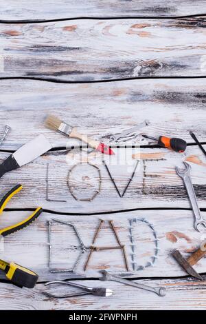 Flat lay composition with construction tools on wooden background. Stock Photo