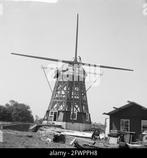 Windmill, named De Riekermolen, is moved and rebuilt on the Amstel river near the tavern Het Kalfje in Amsterdam Buitenveldert. 8-sided ground-sailer, watermill fitted with a screw jack, year of construction 1636, 30 June 1961, rebuilt, mills, The Netherlands, 20th century press agency photo, news to remember, documentary, historic photography 1945-1990, visual stories, human history of the Twentieth Century, capturing moments in time Stock Photo