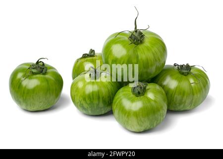 Heap of whole fresh green zebra tomato close up isolated on white background Stock Photo