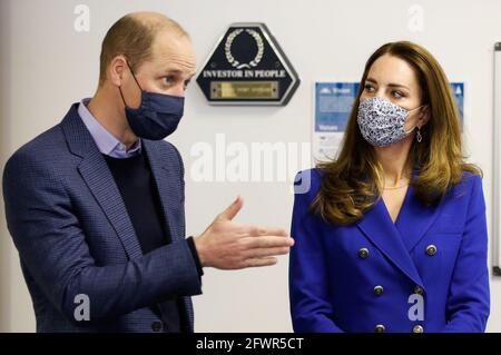 The Duke and Duchess of Cambridge talk to service users during a visit to Turning Point Scotland's social care centre in Coatbridge, North Lanarkshire, to hear about the vital support that they provide to those with complex needs, including addiction and mental health challenges. Picture date: Monday May 24, 2021. Stock Photo