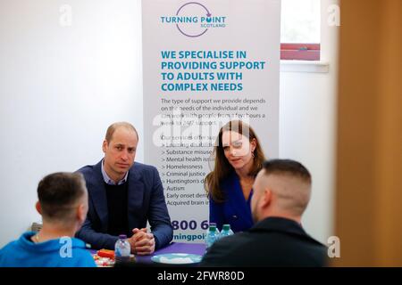 The Duke and Duchess of Cambridge talk to service users during a visit to Turning Point Scotland's social care centre in Coatbridge, North Lanarkshire, to hear about the vital support that they provide to those with complex needs, including addiction and mental health challenges. Picture date: Monday May 24, 2021. Stock Photo