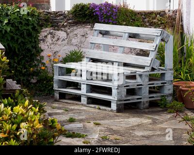 Garden bench made from pallets, Cornwall, UK Stock Photo