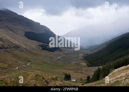 View down Glen Croe from  the Rest and be Thankful, Argyll, Scotland. The A 83 passes through the glen along with the old Military Road on the right. Stock Photo