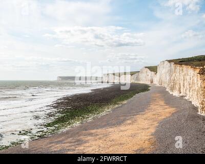 The Seven Sisters white chalk cliffs. The East Sussex coastline of the South Downs nature reserve bordering onto the English Channel. Stock Photo