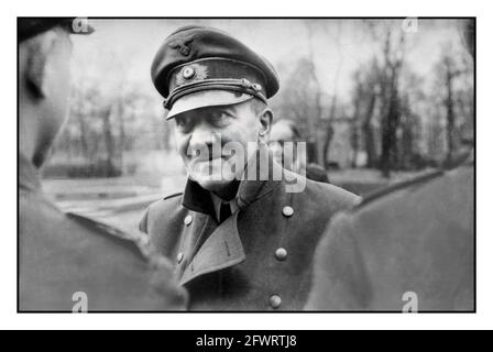 Adolf Hitler April 1945 WW2 Adolf Hitler, one of the very last images of Führer Adolf Hitler giving Iron Cross awards medal decorations to loyal Hitler Youth (HITLERJUGEND) members, Berlin, Nazi Germany,  April 1945 World War II shortly before his suicide and the end of war in Europe    [Digitally restored to the original image impact and quality] Stock Photo