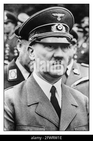 Adolf Hitler WW2 1940's exterior face view in uniform at a military gathering in Nazi Germany Adolf Hitler born: April 20th, 1889 in Braunau am Inn, died: by suicide on April 30th, 1945 in Berlin; in 1920 he took over the leadership of the NSDAP, on January 30, 1933 he became Chancellor and established the fascist dictatorship; on August 2nd, 1934 he made himself head of state and became commander in chief of the armed forces. Adolf Hitler German Führer, (“Leader”), title used by Adolf Hitler to define his role of absolute authority in Germany’s Third Reich (1933–45). Stock Photo