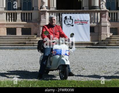 Varese, Italy. 24th May, 2021. Varese, Italy Distinguished Gentleman's Ride world event gathering of motorcyclists of both sexes dressed in vintage and modern style in Varese at Villa Ponti In the photo: motorcyclist with his Vespa Credit: Independent Photo Agency/Alamy Live News Stock Photo