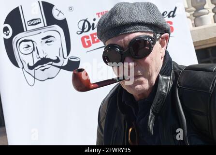 Varese, Italy. 24th May, 2021. Varese, Italy Distinguished Gentleman's Ride world event gathering of motorcyclists of both sexes dressed in vintage and current style in Varese at Villa Ponti In the photo: motorcyclist with his look Credit: Independent Photo Agency/Alamy Live News Stock Photo