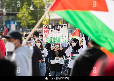 Berlin, Germany. 24th May, 2021. Participants hold up a sign during a rally titled 'Solidarity with Gaza, Jerusalem and Sheikh Al Jarrah' at Breitscheidplatz. Credit: Christoph Soeder/dpa/Alamy Live News Stock Photo