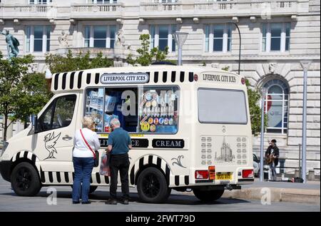 Tourists buying an ice cream at Liverpool Waterfront Stock Photo