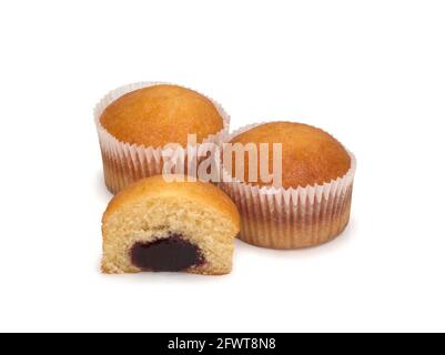Two muffins and a half on white background, close up Stock Photo