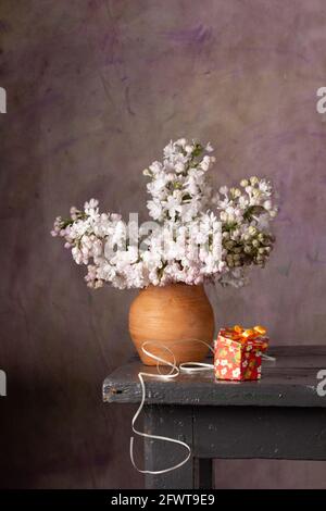 Still life with a bouquet of lilacs Stock Photo - Alamy
