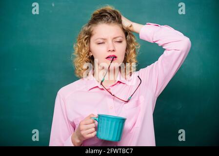 idea and inspiration. energy and vigor. energy charge. good morning. girl refreshing with drink. sleepy tired woman with coffee cup at blackboard Stock Photo