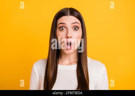 Photo of shocked frightened person open mouth staring camera cant believe isolated on yellow color background Stock Photo