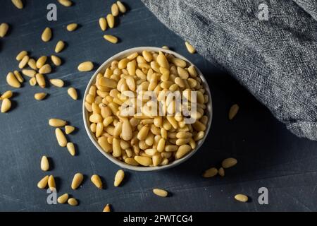 Raw Organic Pine Nuts in a Bowl Stock Photo