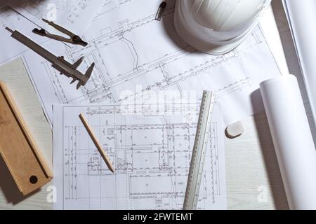 Work desk of the architect of the design project sketches. Workplace of a civil engineer creating blueprints. Top view. Stock Photo
