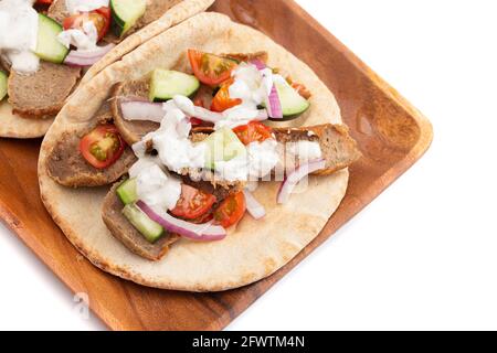 Gyro with Vegetables and Garlic White Sauce on a White Background Stock Photo