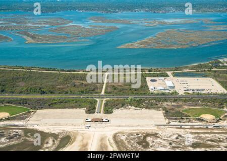 Aerial view over Nassau County on Long Island New York with beach and parking Stock Photo