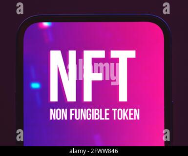 NFT non fungible token crypto art logo on the screen of modern mobile phone, close-up, blockchain concept Stock Photo
