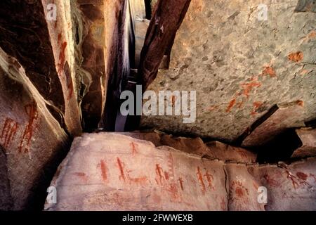 Anasazi shamanistic pictographs adorn these jumbled blocks of sandstone in the Whitmore Wash of the Grand Canyon.  The flying figures are very similar to those depicted in Kanab Creek Basin; a distance up the Grand Canyon; both sites interpreted by Southern Paiute consultants as having been Ghost Dance sites in the late 19th century; (Stoffle et al. 1994). Stock Photo