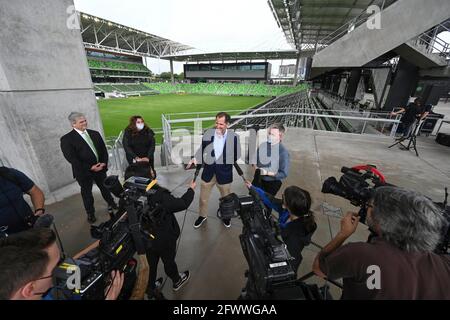 Austin, TX USA, May 24, 2021: Austin FC president ANDY LOUGHNANE and Austin Mayor STEVE ADLER (far left) announce that declining pandemic numbers will allow 100% stadium capacity for Austin's Major League Soccer opening game next month. The Stadium will host the U.S. Soccer Women's National Team in a friendly with Nigeria on June 16th, 2021. Credit: Bob Daemmrich/Alamy Live News Stock Photo