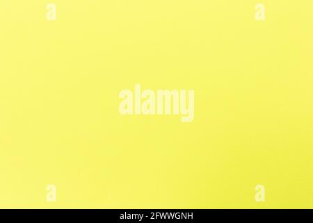 Bright yellow paper texture background, colored cardboard fibers and grainy texture, empty space Stock Photo