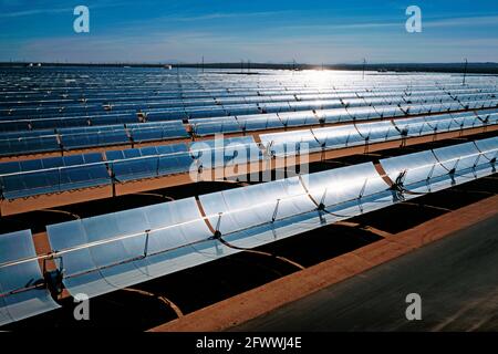 Solar electric collectors at sunrise at the power station in Kramer Junction; California. Stock Photo
