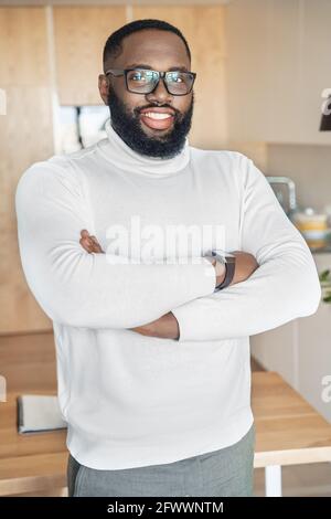 Portrait of confident smiling african american man with folded arms on chest Stock Photo