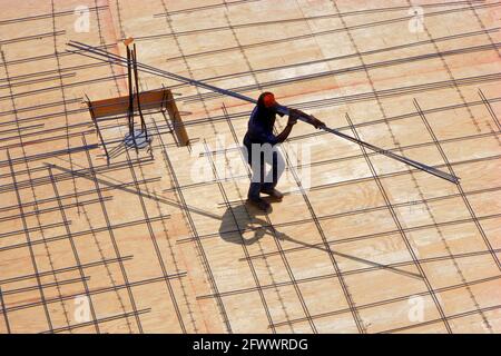 Construction Worker with Rebar Stock Photo