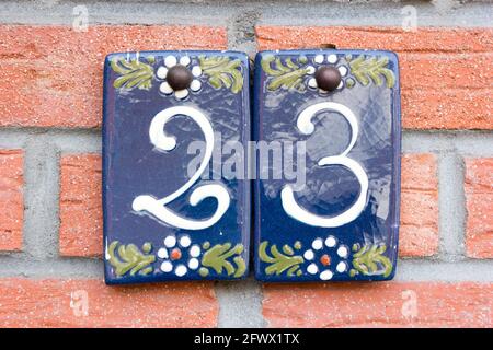 Number 23 in white on blue ceramic plates Stock Photo