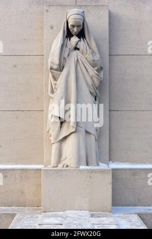 Valenciennes, France, 2017/01/02. Statue of a mourning woman on a tombstone at Saint Roch cemetery. Stock Photo